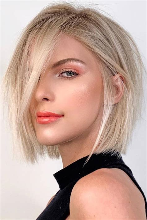 Look sleek and feminine with a blonde lob. A long bob is one of the best haircuts for fat faces. The longest pieces falling around your face help slim and elongate your facial appearance. Avoid short, straight-across bangs because they make your round face look too small. Instagram @alyssakooc_hair.